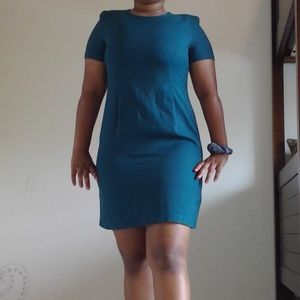 teal dress with shoulder pads